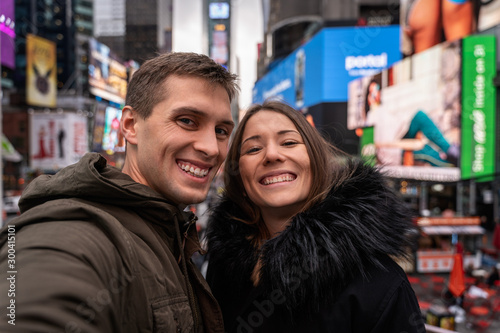 young couple self portrait in times square