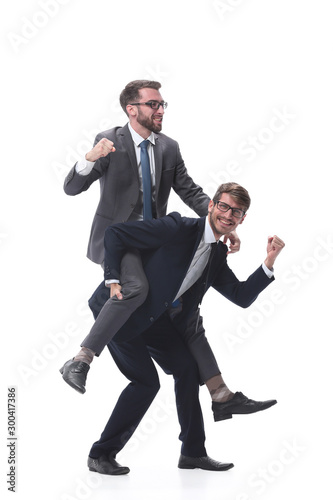 happy businessman carrying his colleague on the piggyback