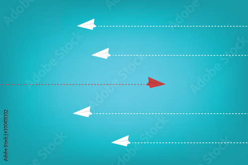 Different Approach - Different Direction. Group of paper airplane in one direction and with one individual pointing in the different way, can be used leadership/individuality/innovation concepts.
