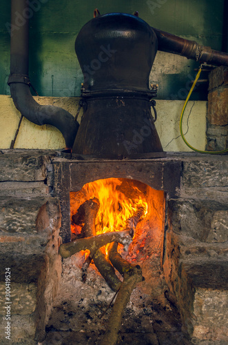 Traditional distillation of raki - tsipouro in Crete - kazani .