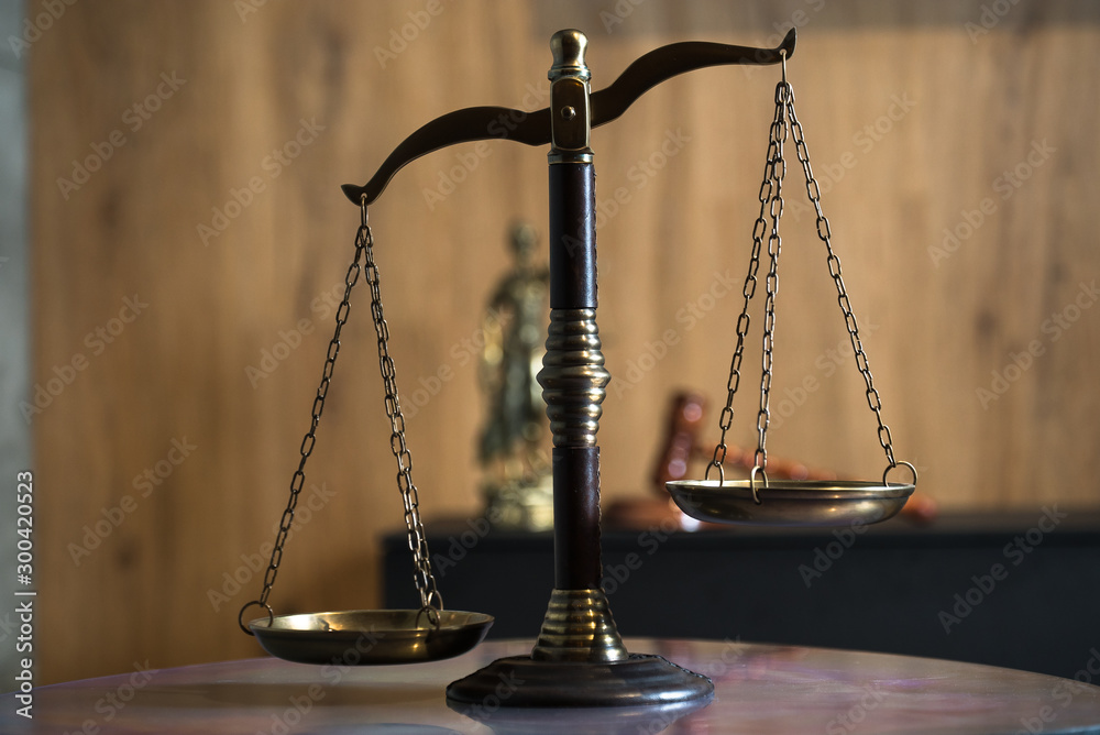 Law and Justice concept. Mallet of the judge, books, scales of justice. Gray stone background, reflections on the floor, place for typography. Courtroom theme. Law and Justice concept. Mallet of the judge, books, scales of justice. Gray stone background, reflections on the floor, place for typography. Courtroom theme.