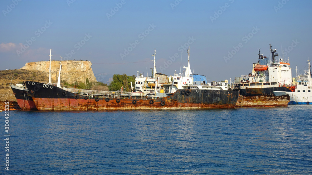 Old abandoned shipyard with scrap boats left to rust