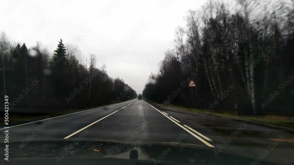 travel by car.car ride on a deserted country road on a cloudy fall day.first-person view.video recording from the cockpit. travel by car.car ride on a deserted country road on a cloudy fall day.first-person view.video recording from the cockpit.