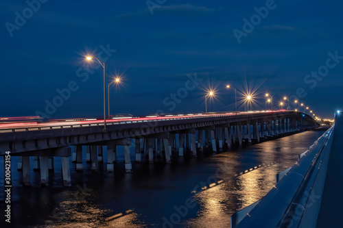 Tampa Bay at night with cars passing and city lights © Karyn