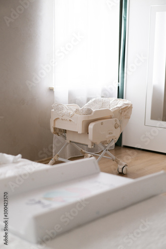crib is in the parents' bedroom the first days of the baby at home © Elena Gorina