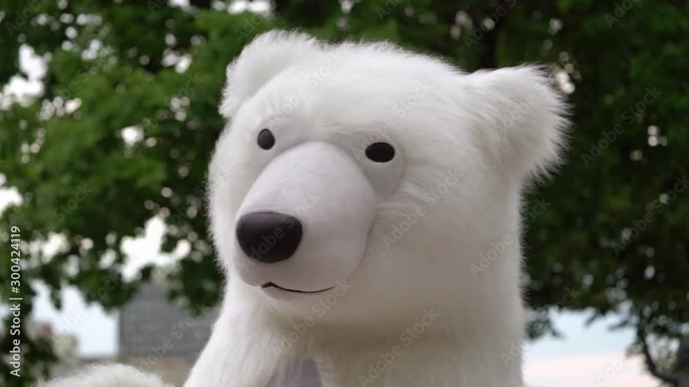 Person in a costume of white bear. Polar bear puppet outdoors party Person in a costume of white bear. Polar bear puppet outdoors party