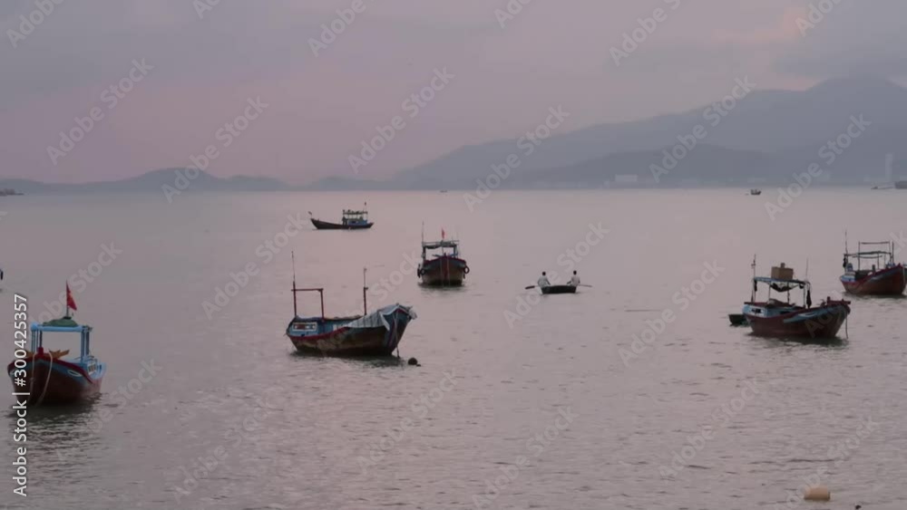 fishing boats in Vietnam near the sea with a view of the dawn, city, mountains, islands, time lapses fishing boats in Vietnam near the sea with a view of the dawn, city, mountains, islands, time lapses