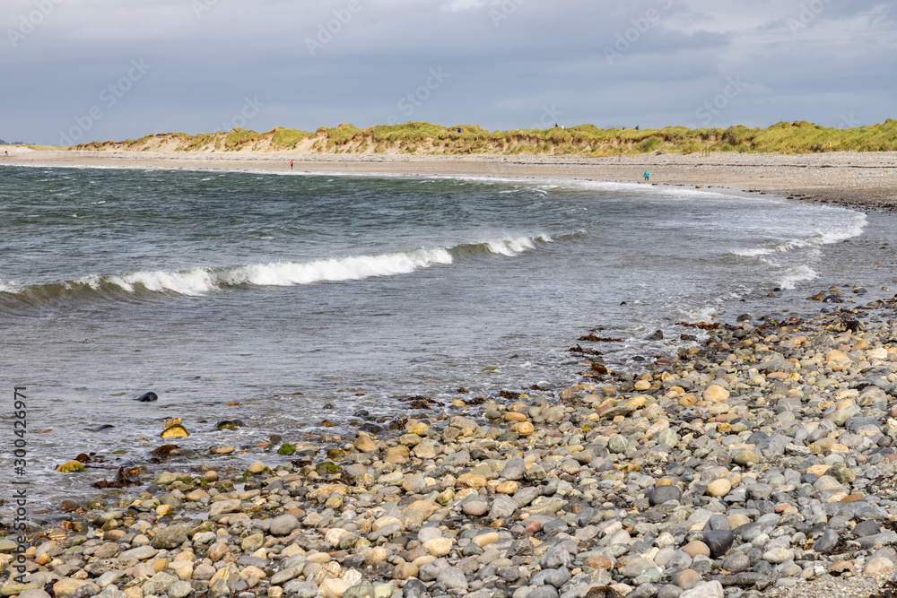 Waves and rocks at Bertra beach in cloudy day Waves and rocks at Bertra beach in cloudy day
