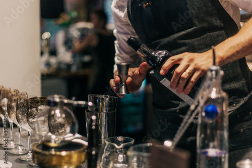 Photography Bartender making cocktails at the bar, alcoholic drinks