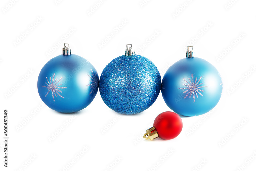 Three blue Christmas balls and one red isolated Three blue Christmas balls and one red isolated