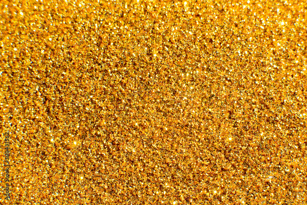 Abstract defocused background with glittering golden particles Abstract defocused background with glittering golden particles