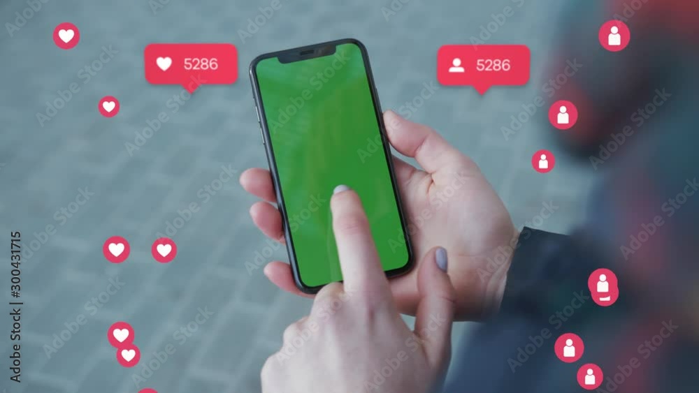 Close up hands woman holding phone with vertical green screen on busy ...