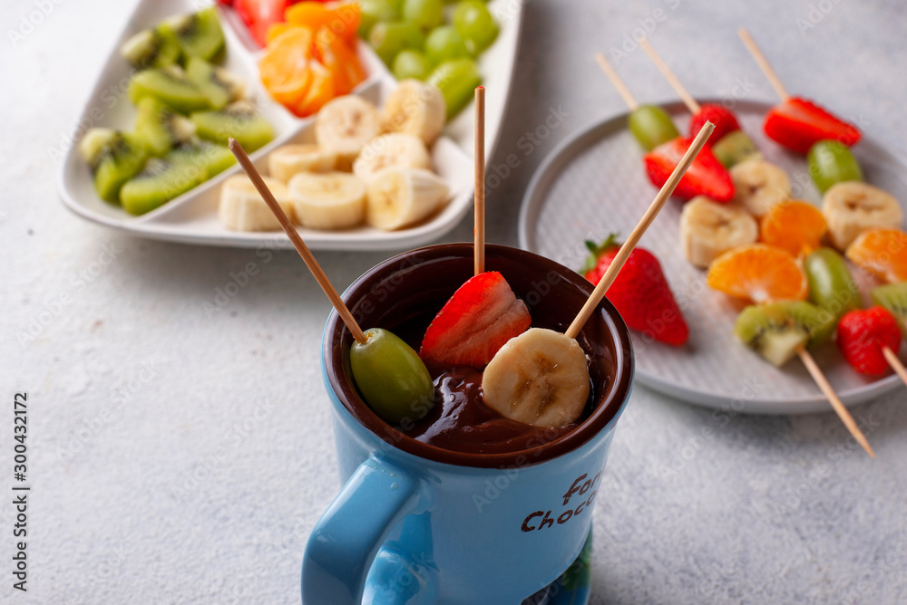 Sweet chocolate fondue with fruits Sweet chocolate fondue with fruits