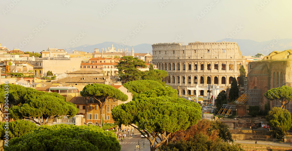 Rome cityscape skyline with landmarks of the Ancient Rome: Coliseum and Roman Forum famous travel destinations of Italy.