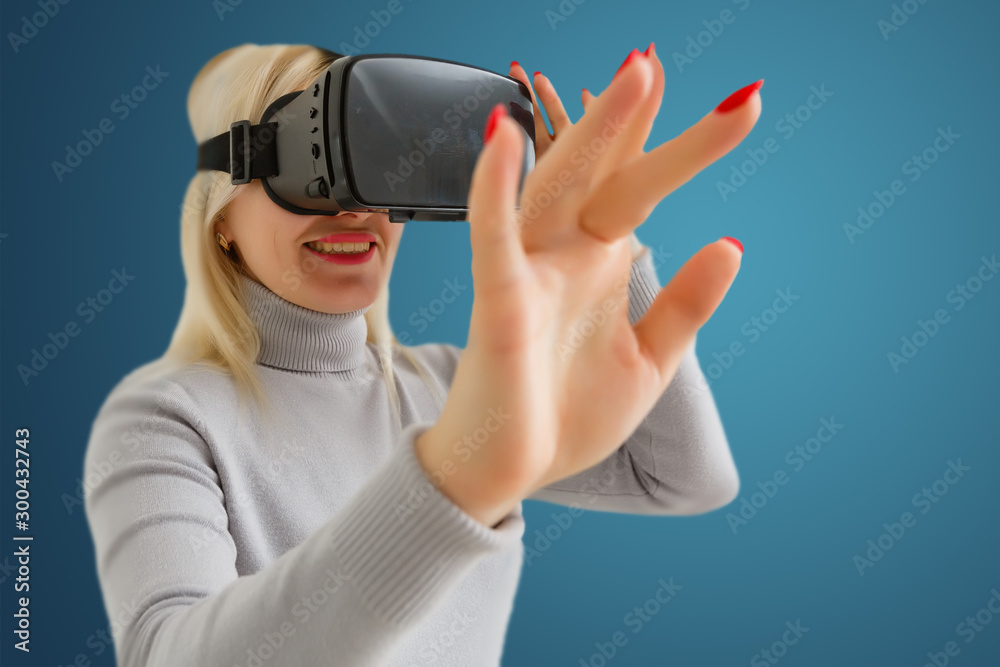 woman playing game in virtual reality glasses woman playing game in virtual reality glasses