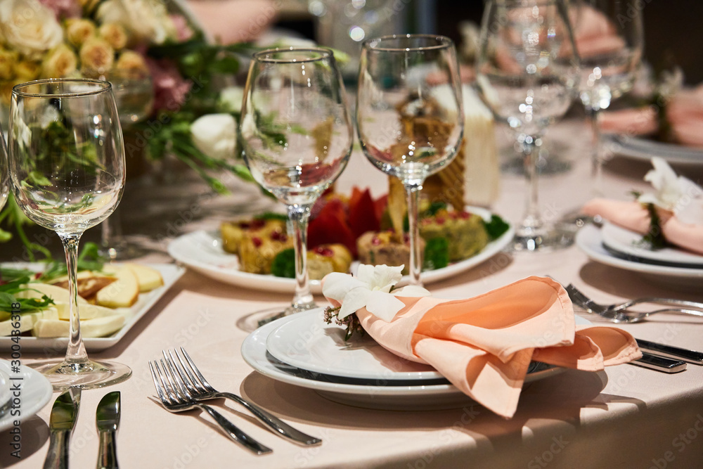 A luxurious covered table for the holiday in an expensive restaurant.