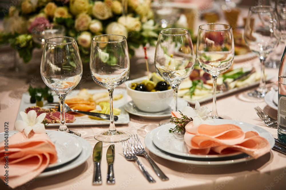 A luxurious covered table for the holiday in an expensive restaurant. A luxurious covered table for the holiday in an expensive restaurant.