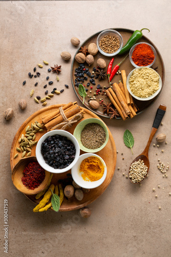 Spice set on rustic plate, condiment and seasoning