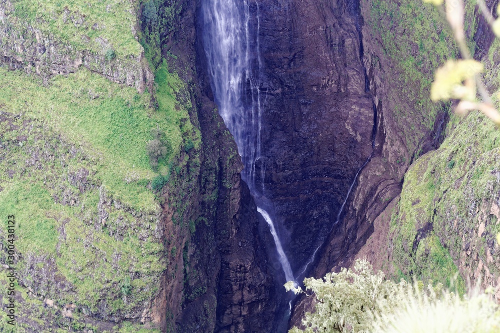 Obraz premium The Jin Bahir waterfall in the Geech Abyss canon in the Simien Mountains in Ethiopia.