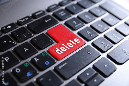 Close-up view on conceptual notebook keyboard - Delete(red key,button)