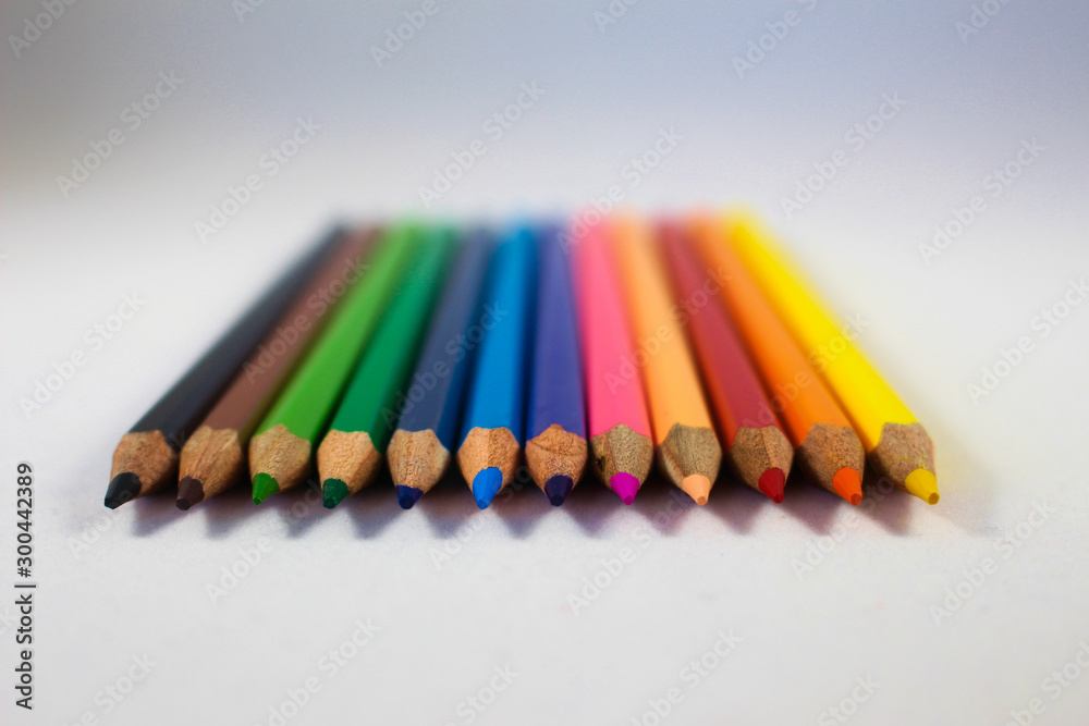 Fototapeta premium Rainbow colored pencils with selected focus on tips