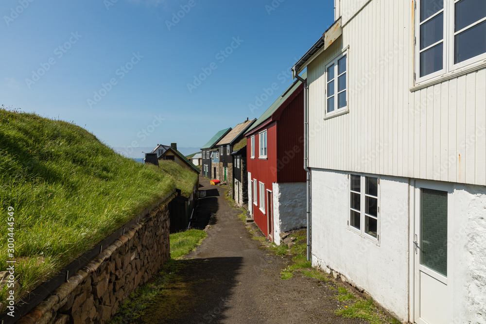 Beautiful village of Mykines with colorful houses with grass on the roofs, Mykines island, Faroe Islands, Europe. Beautiful village of Mykines with colorful houses with grass on the roofs, Mykines island, Faroe Islands, Europe.
