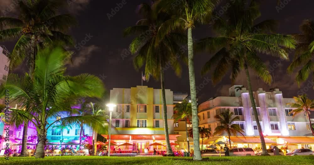 VIDEO LOOP SEAMLESS: Miami Beach, Florida, USA on Ocean Drive at famous South Beach at sunset with famous colorful art deco buildings. timelapse video in 4K.