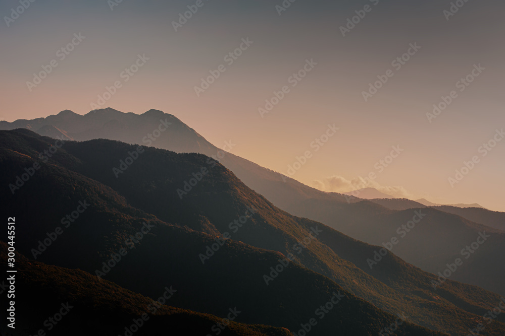 Mountains Landscape. Beautiful Dramatic Mountain peaks at sunset.