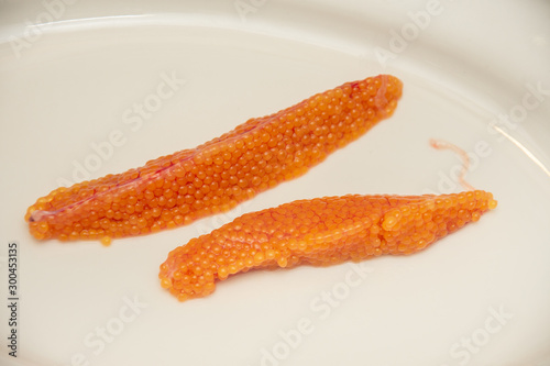 Orange caviar rye from trout fish on a plate 