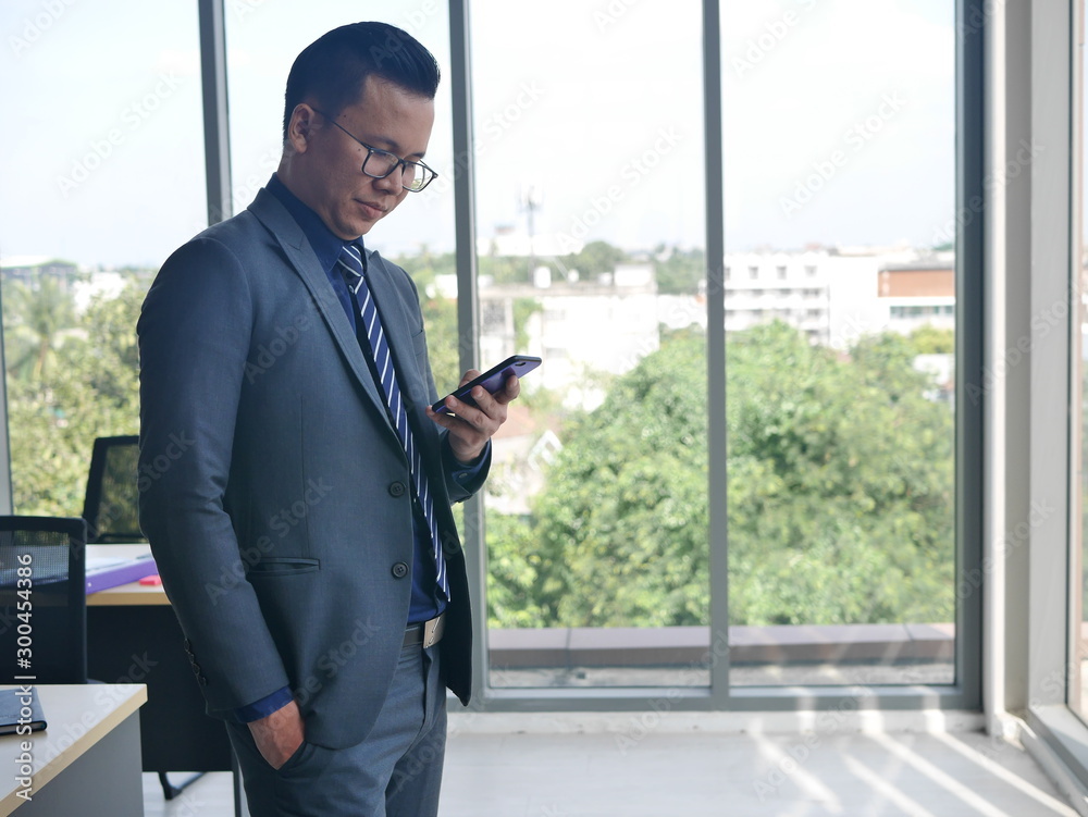 businessman using mobile phone in the city
