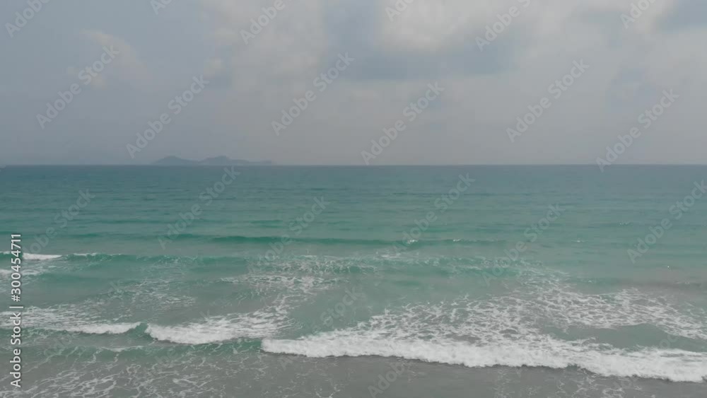 A flying camera captures a sea wave on a sandy beach in Vietnam. A flying camera captures a sea wave on a sandy beach in Vietnam.