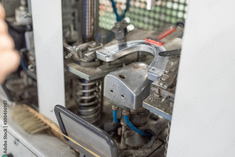 Fototapeta premium Forming the front part on a special machine. Shoe production.