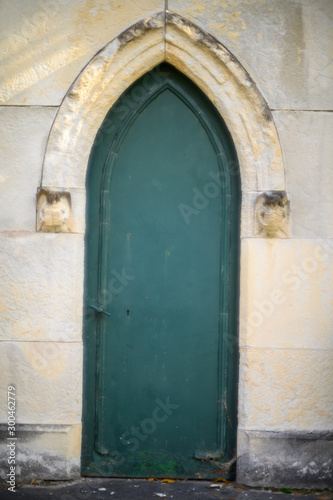 old green wooden door © Christopher