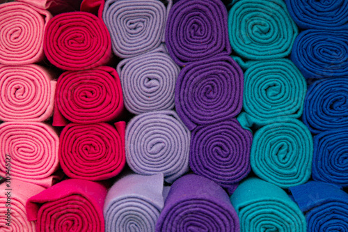 abstract background of rolled blankets in different colors