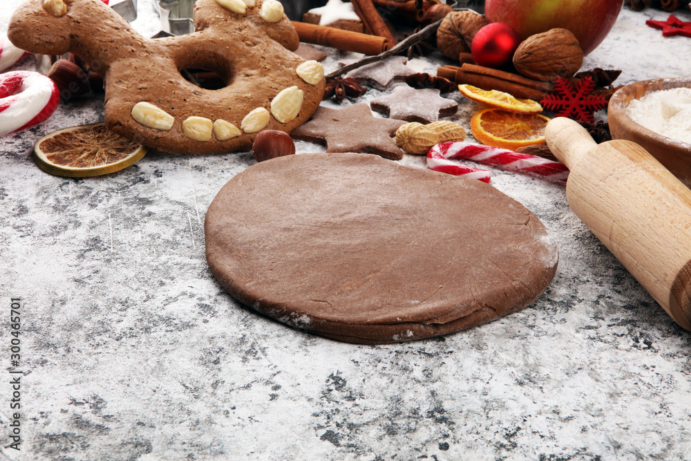 Baking christmas cookies. Typical cinnamon stars bakery with spices. xmas decoration on table Baking christmas cookies. Typical cinnamon stars bakery with spices. xmas decoration on table