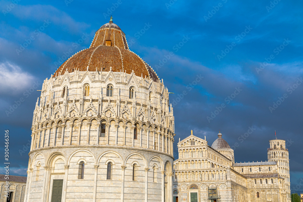 Baptistery, Cathedral and the Pisa Leaning tower in the famous Pisa's Cathedral Square, Square of Miracles (Piazza dei Miracoli)
