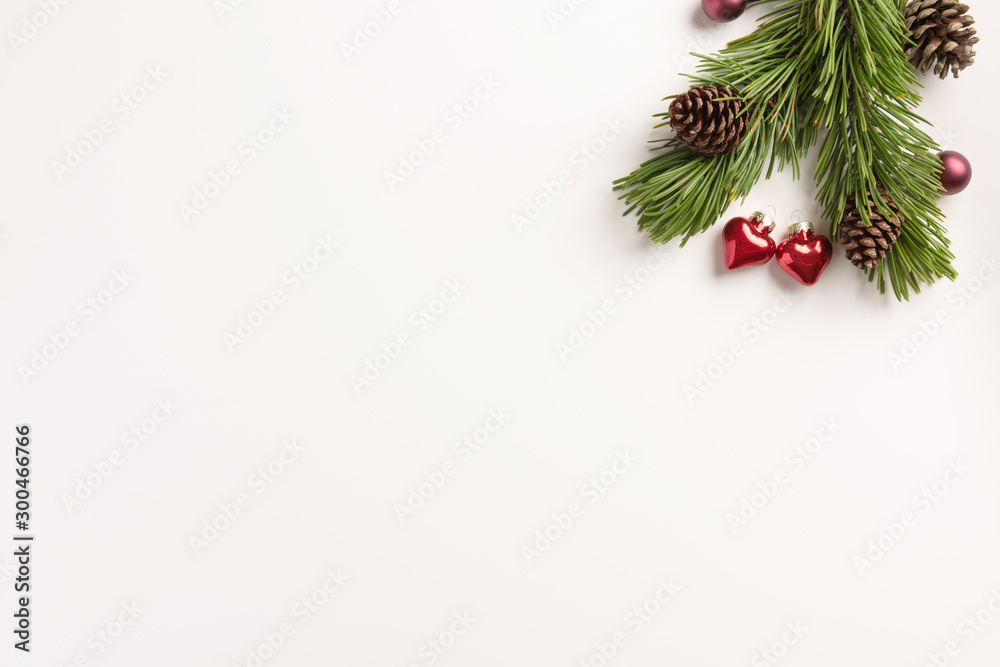 Christmas composition. Spruce branches with small hearts, on a white background. Christmas, winter concept. Flat lay, top view, copy space. Christmas composition. Spruce branches with small hearts, on a white background. Christmas, winter concept. Flat lay, top view, copy space.