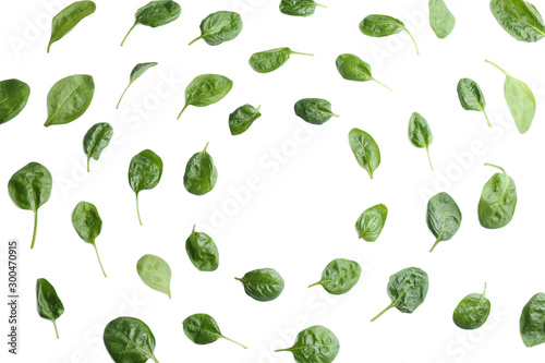 Fresh green healthy baby spinach leaves on white background, top view. Space for text