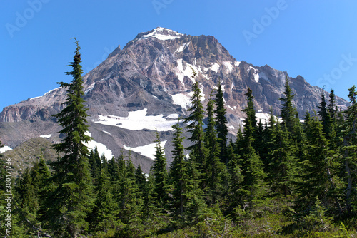 A summer time view of the Northwest side of Mt. Hood from the timberline trail. Visable is what is left of the Glisan Glacier and Pulpit Rock.