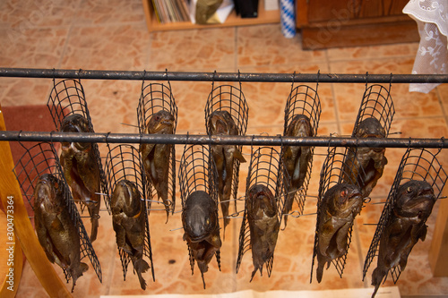 Photography Fresh smoked fish in a smokehouse: carps, trouts