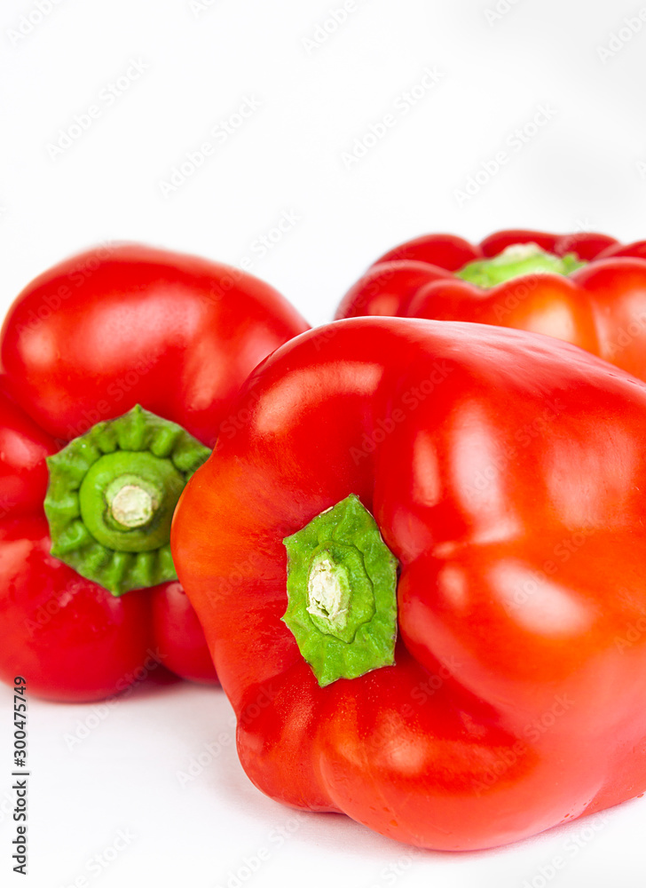 RED PEPPERS ON WHITE BACKGROUND RED PEPPERS ON WHITE BACKGROUND