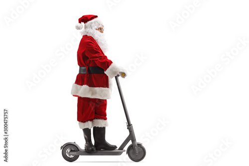 Santa Claus riding an electric scooter