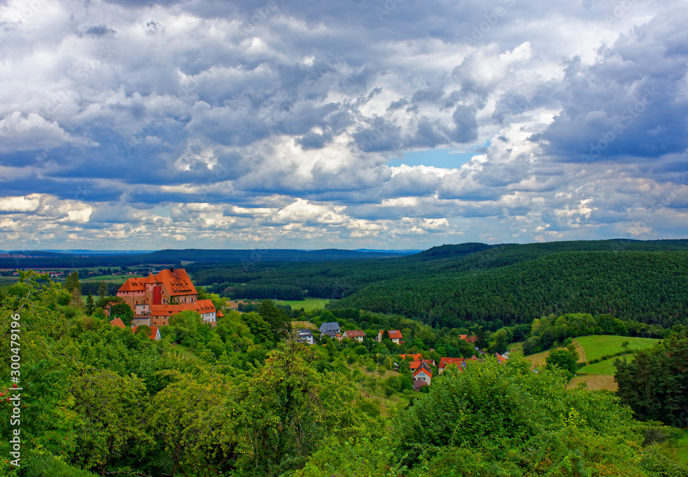 Beautiful sky with clouds over the ancient castle Burg Wernfels