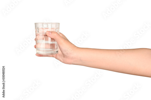 Hand holding glass of water isolated on white background.