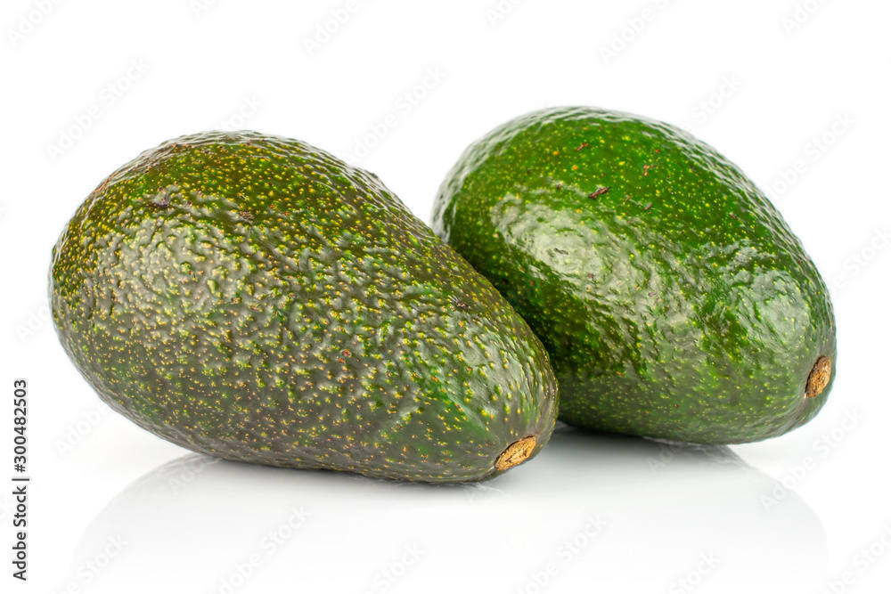 Group of two whole fresh green avocado isolated on white background Group of two whole fresh green avocado isolated on white background