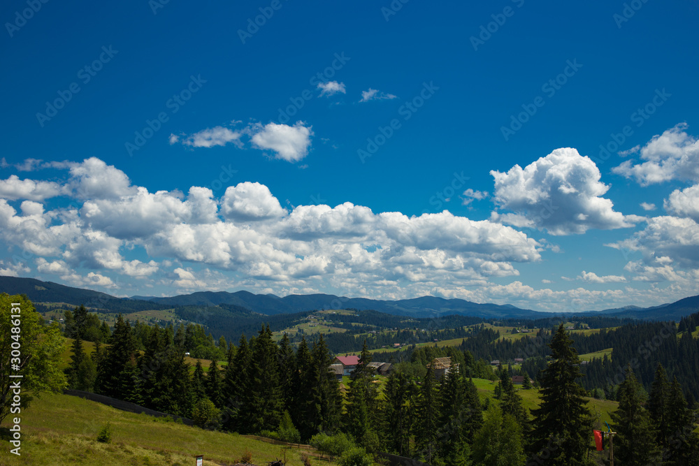 Amazing Panoramic View of the Mighty Carpathians Mountains and Beautiful Blue Sky Background.