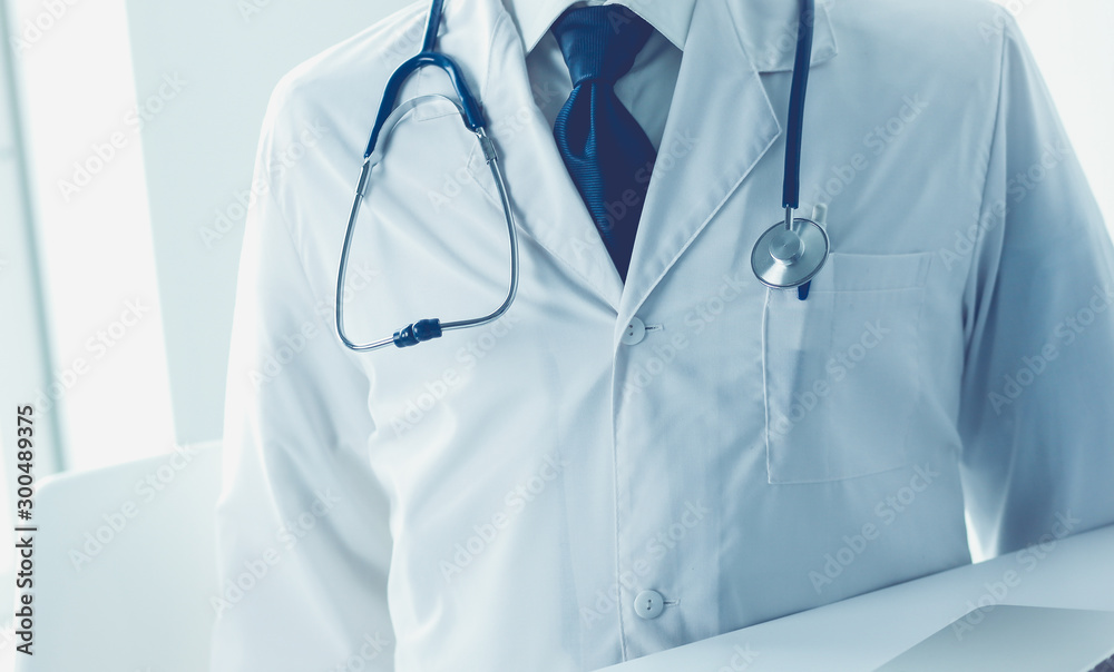 Doctors working on computer at hospital. Doctors working on computer at hospital.