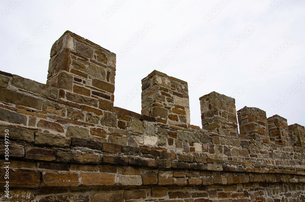 The wall of the old fortress, towers and structures, the ruins of the old fortress.