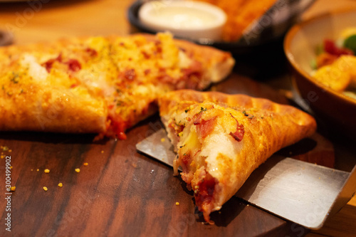 pizza puff on wooden plate © lamaip