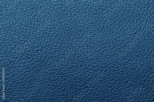 Blue artificial leather texture. Macro closeup abstract fashion background.
